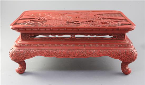 A Chinese red lacquer low table, 42cm long x 29.5cm deep
